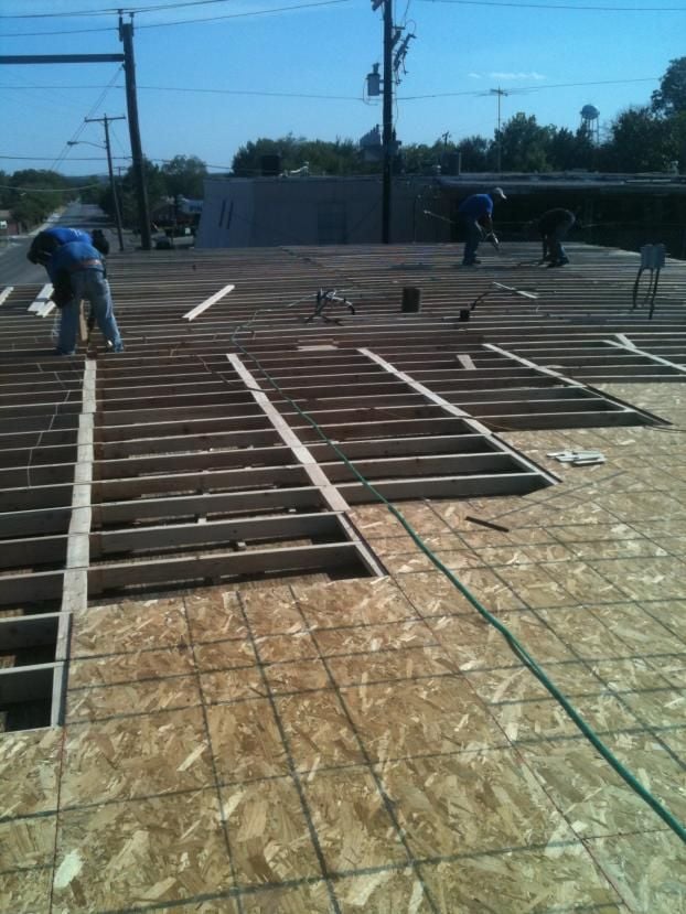 Before a completed large commercial roofing company project in the  area